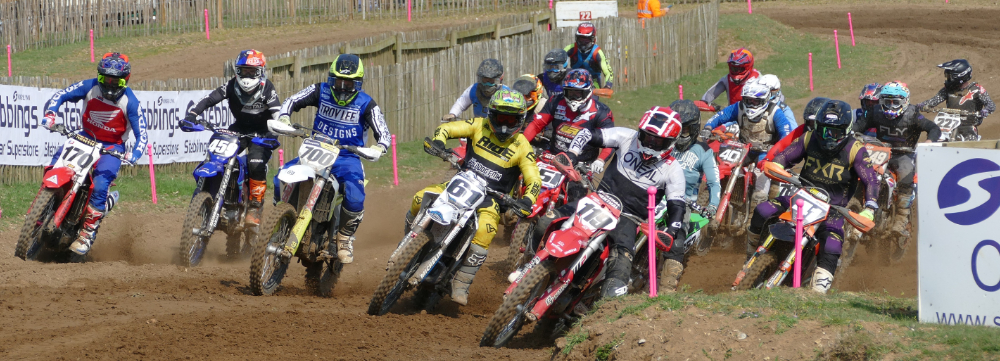 motocross bikes heading into a turn